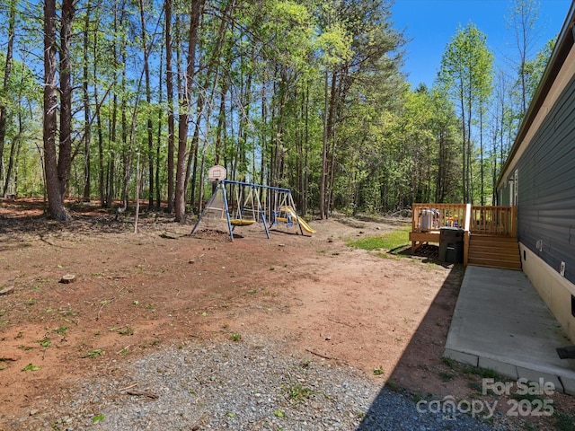 2234 Emerald Mine Rd, Shelby, NC 28152 - view of yard with a wooden deck and a playground