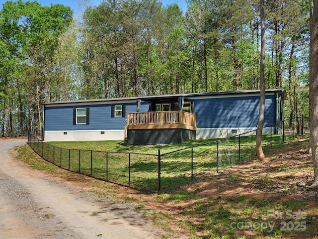 2234 Emerald Mine Rd, Shelby, NC 28152 - manufactured / mobile home featuring a wooden deck, fence private yard, dirt driveway, and a front lawn
