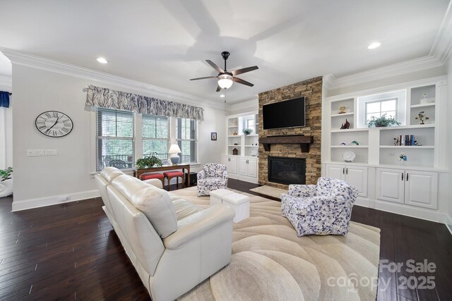 141 Forsythia Ln, Tega Cay, SC 29708 - living room featuring crown molding, baseboards, dark wood-style floors, and a fireplace