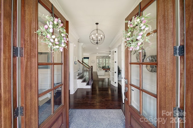 141 Forsythia Ln, Tega Cay, SC 29708 - hall with ornamental molding, a chandelier, stairway, wood finished floors, and french doors