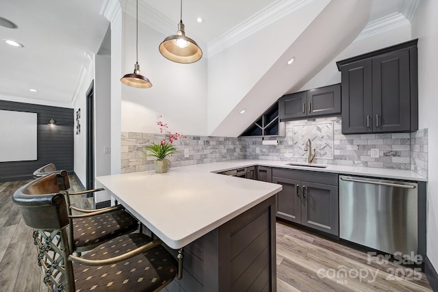 141 Forsythia Ln, Tega Cay, SC 29708 - kitchen with ornamental molding, a peninsula, light countertops, stainless steel dishwasher, and a sink