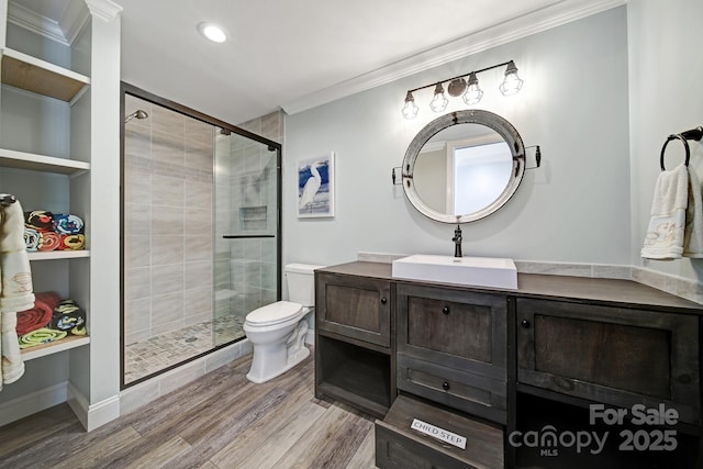 141 Forsythia Ln, Tega Cay, SC 29708 - bathroom with a shower stall, ornamental molding, toilet, and wood finished floors
