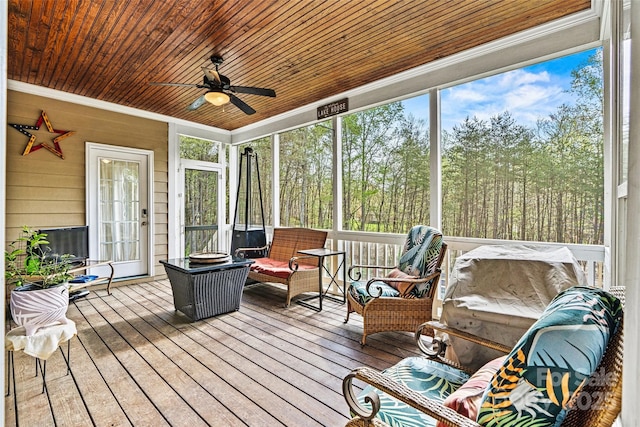 sunroom / solarium with ceiling fan