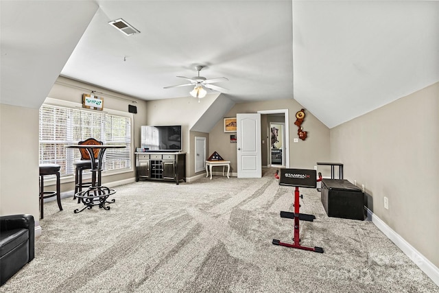 recreation room with a ceiling fan, visible vents, carpet floors, baseboards, and lofted ceiling