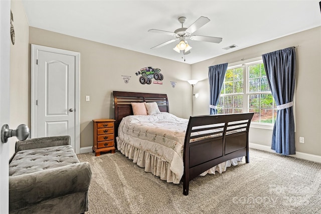 bedroom with visible vents, baseboards, ceiling fan, and light colored carpet