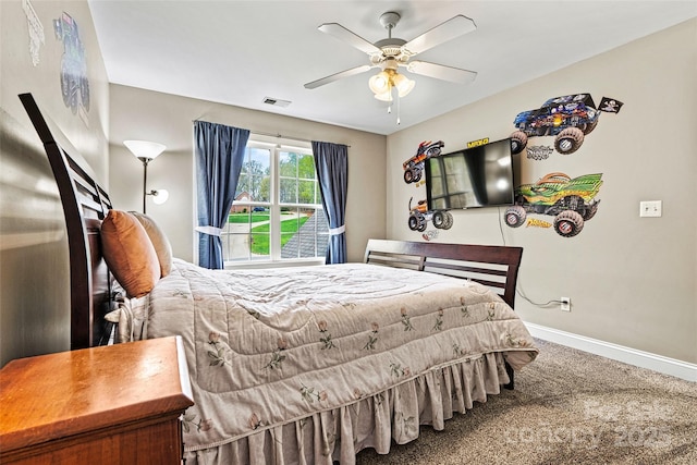 carpeted bedroom with baseboards, ceiling fan, and visible vents