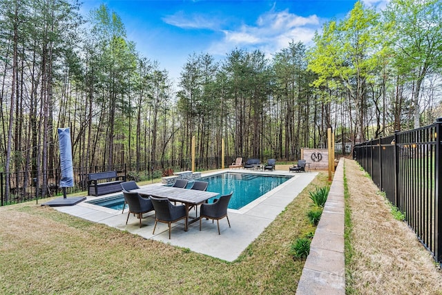 view of pool featuring a lawn, a fenced in pool, a fenced backyard, and a patio area