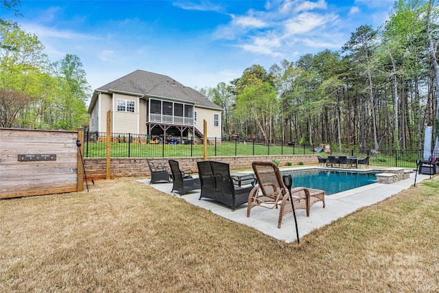 view of swimming pool featuring a patio, a fenced backyard, a sunroom, a fenced in pool, and a lawn