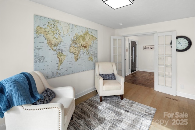 4075 Little River Rd, Hendersonville, NC 28739 - sitting room with french doors and wood finished floors