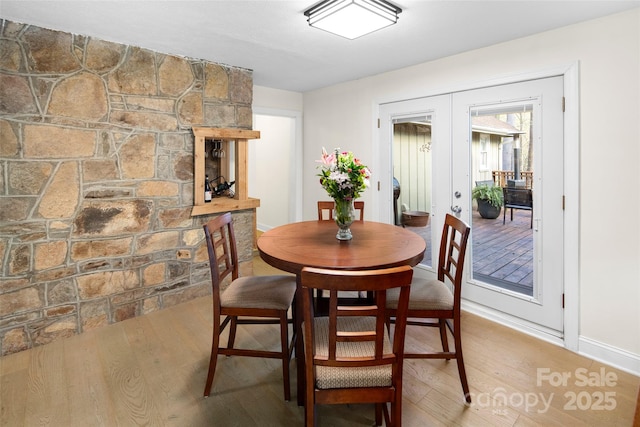 4075 Little River Rd, Hendersonville, NC 28739 - dining space featuring french doors and light wood-type flooring