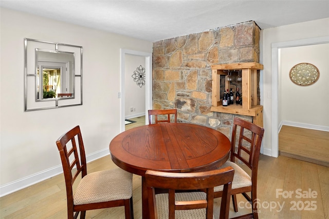 4075 Little River Rd, Hendersonville, NC 28739 - dining area with light wood-style floors and baseboards