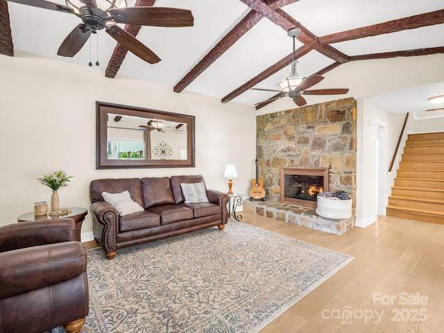 4075 Little River Rd, Hendersonville, NC 28739 - living room with a ceiling fan, stairway, wood finished floors, and a stone fireplace