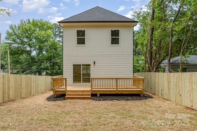 2512 Remington St, Charlotte, NC 28216 - rear view of house with roof with shingles and a wooden deck