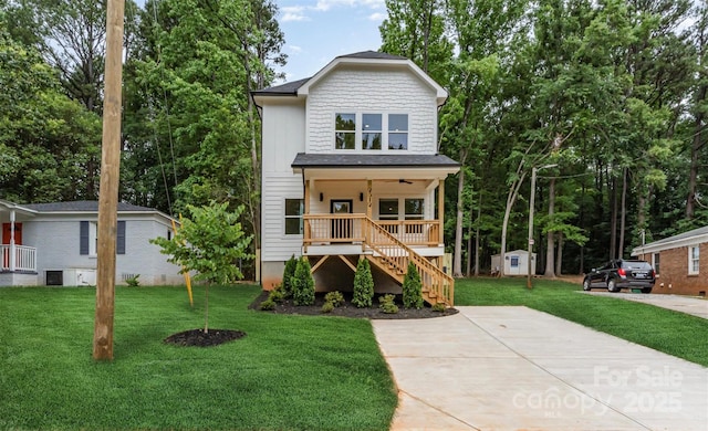 2512 Remington St, Charlotte, NC 28216 - view of front of property featuring a porch, stairway, a front yard, and an outbuilding