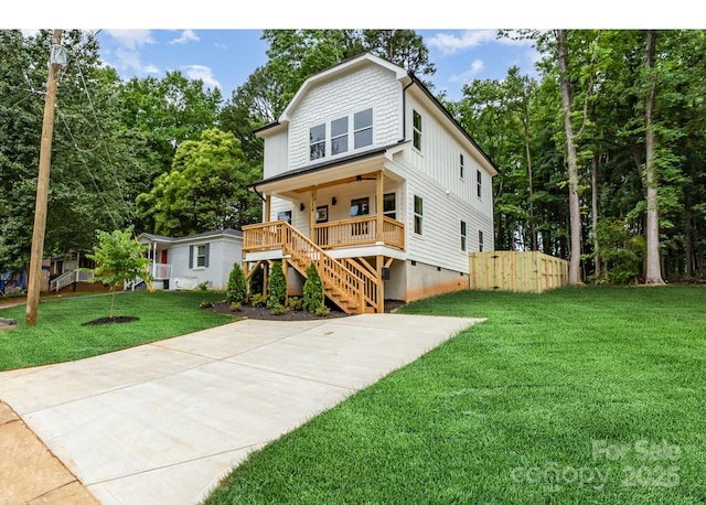 2512 Remington St, Charlotte, NC 28216 - view of front of property with a porch, stairway, a front lawn, a ceiling fan, and board and batten siding