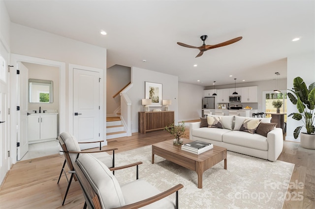 2512 Remington St, Charlotte, NC 28216 - living area featuring a ceiling fan, stairs, light wood-style floors, recessed lighting, and baseboards