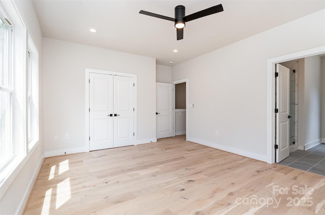 2512 Remington St, Charlotte, NC 28216 - unfurnished bedroom with light wood-style floors, baseboards, ensuite bathroom, a closet, and recessed lighting
