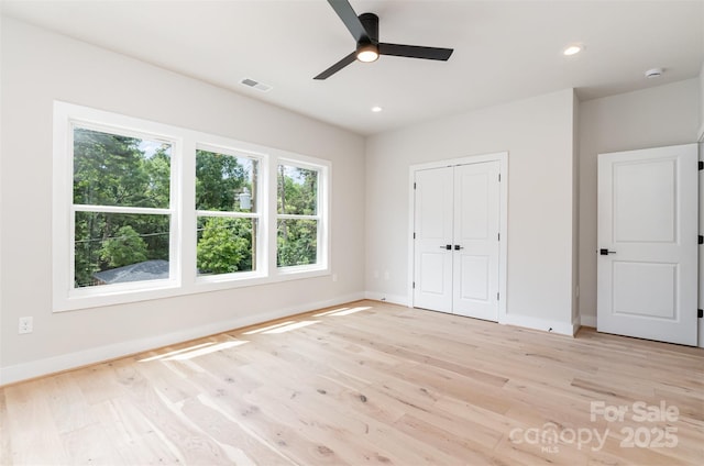 2512 Remington St, Charlotte, NC 28216 - unfurnished bedroom featuring baseboards, light wood-type flooring, recessed lighting, and a closet