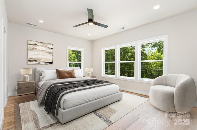 2512 Remington St, Charlotte, NC 28216 - bedroom with light wood finished floors, baseboards, recessed lighting, and ceiling fan