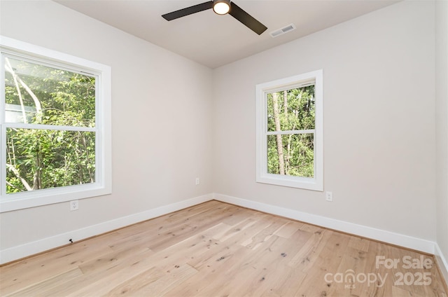 2512 Remington St, Charlotte, NC 28216 - unfurnished room with baseboards, ceiling fan, and wood finished floors