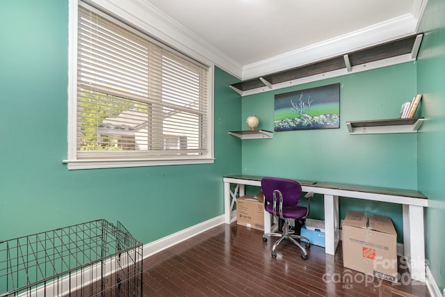 office area featuring baseboards, crown molding, and wood finished floors