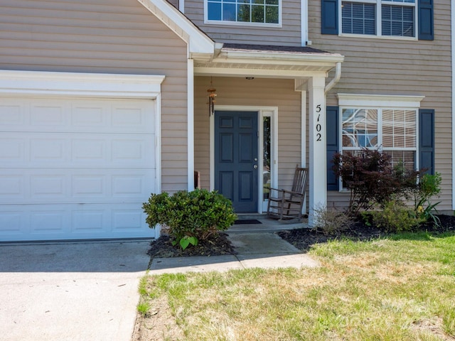 5102 Candleglow Ct, Indian Trail, NC 28079 - entrance to property featuring covered porch, an attached garage, and driveway