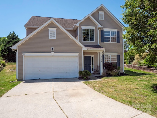 5102 Candleglow Ct, Indian Trail, NC 28079 - traditional-style home featuring driveway, a front yard, and a garage