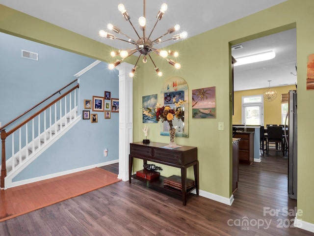 5102 Candleglow Ct, Indian Trail, NC 28079 - interior space featuring visible vents, wood finished floors, baseboards, a notable chandelier, and stairs