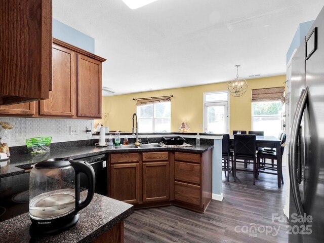5102 Candleglow Ct, Indian Trail, NC 28079 - kitchen with a healthy amount of sunlight, a sink, freestanding refrigerator, a peninsula, and dishwashing machine