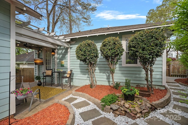 back of house featuring fence, a pergola, and a patio
