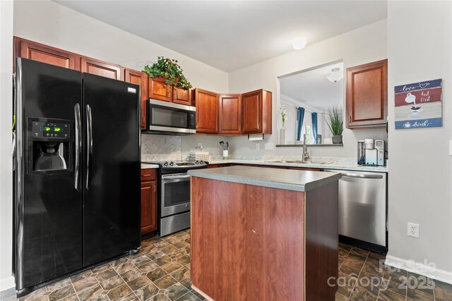 12905 Bullock Greenway Blvd, Charlotte, NC 28277 - kitchen with a kitchen island, a sink, stone finish flooring, and stainless steel appliances
