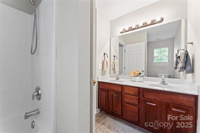 12905 Bullock Greenway Blvd, Charlotte, NC 28277 - bathroom with a sink, toilet, double vanity, and shower / bathtub combination
