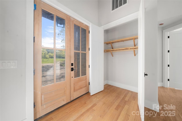 29 Wild Deer Trl, Zirconia, NC 28790 - entryway featuring french doors and light wood-style flooring