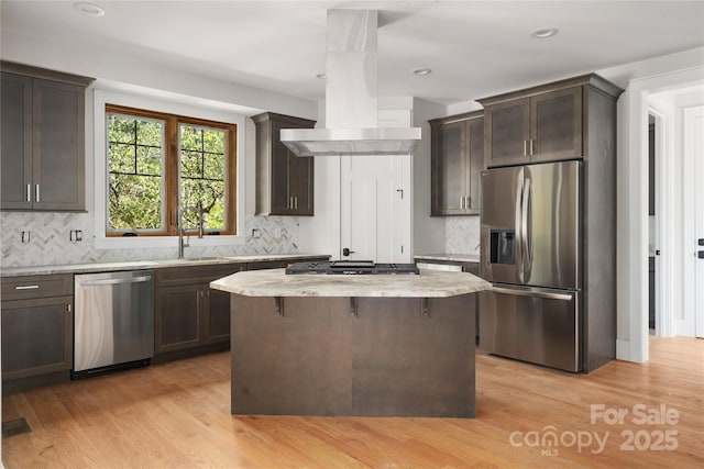 29 Wild Deer Trl, Zirconia, NC 28790 - kitchen featuring stainless steel appliances, ventilation hood, light stone counters, decorative backsplash, and recessed lighting