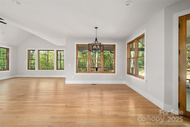 29 Wild Deer Trl, Zirconia, NC 28790 - unfurnished dining area with a chandelier, light wood-style flooring, recessed lighting, and lofted ceiling