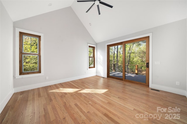 29 Wild Deer Trl, Zirconia, NC 28790 - unfurnished room with high vaulted ceiling, a ceiling fan, healthy amount of natural light, and light wood-type flooring