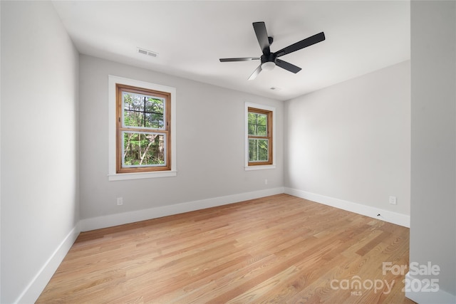 29 Wild Deer Trl, Zirconia, NC 28790 - unfurnished room featuring healthy amount of natural light, light wood-type flooring, and a ceiling fan
