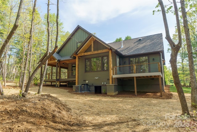 29 Wild Deer Trl, Zirconia, NC 28790 - back of property featuring board and batten siding, a deck, and roof with shingles