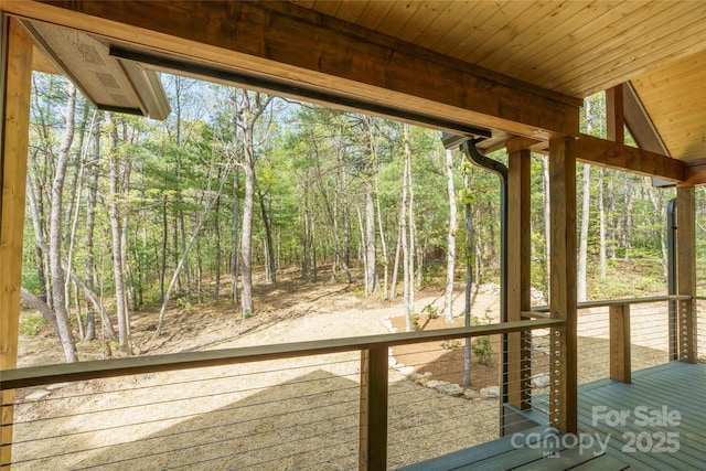 29 Wild Deer Trl, Zirconia, NC 28790 - wooden terrace featuring a wooded view