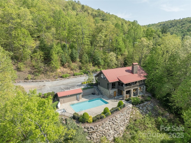 29 Wild Deer Trl, Zirconia, NC 28790 - aerial view of property and surrounding area featuring a forest and a pool