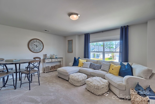 carpeted living area with visible vents