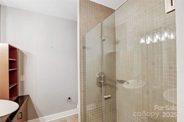 full bath with a tile shower