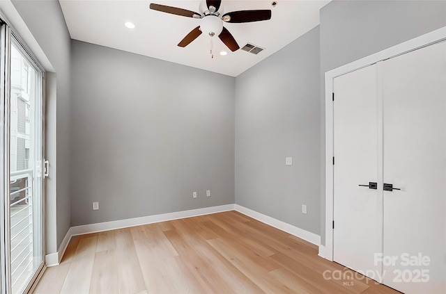 unfurnished bedroom with visible vents, light wood-style flooring, recessed lighting, and baseboards