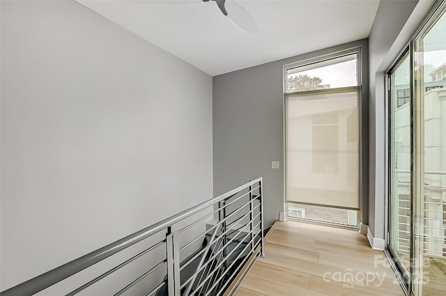 interior space featuring an upstairs landing and light wood finished floors