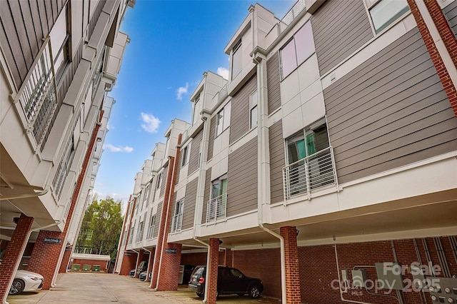 view of property featuring uncovered parking