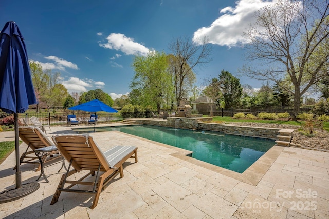 view of pool featuring a fenced backyard, a fenced in pool, and a patio