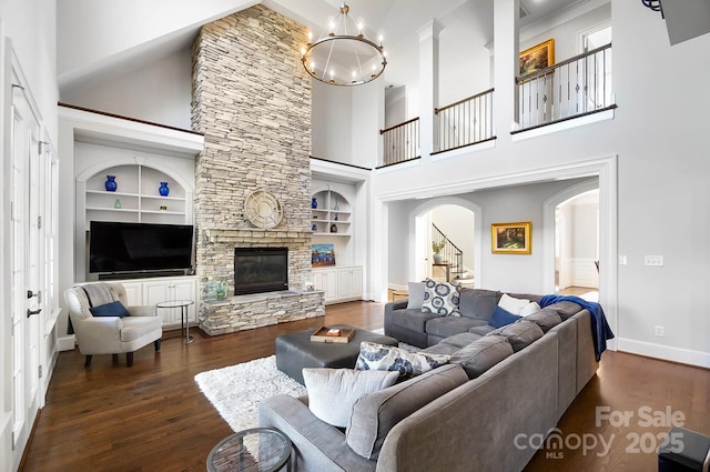 1404 Churchill Downs Dr, Waxhaw, NC 28173 - living room featuring dark wood-type flooring, built in shelves, and a towering ceiling