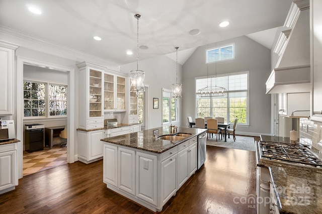 1404 Churchill Downs Dr, Waxhaw, NC 28173 - kitchen featuring white cabinets, appliances with stainless steel finishes, a sink, a chandelier, and glass insert cabinets
