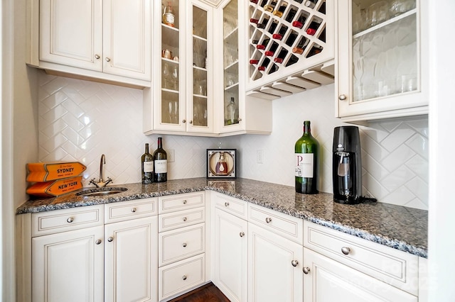 1404 Churchill Downs Dr, Waxhaw, NC 28173 - bar featuring a sink, bar, and backsplash