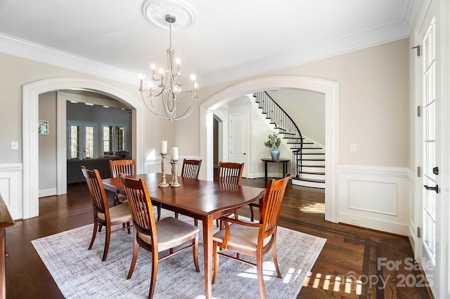 1404 Churchill Downs Dr, Waxhaw, NC 28173 - dining room featuring crown molding, arched walkways, stairs, and a chandelier